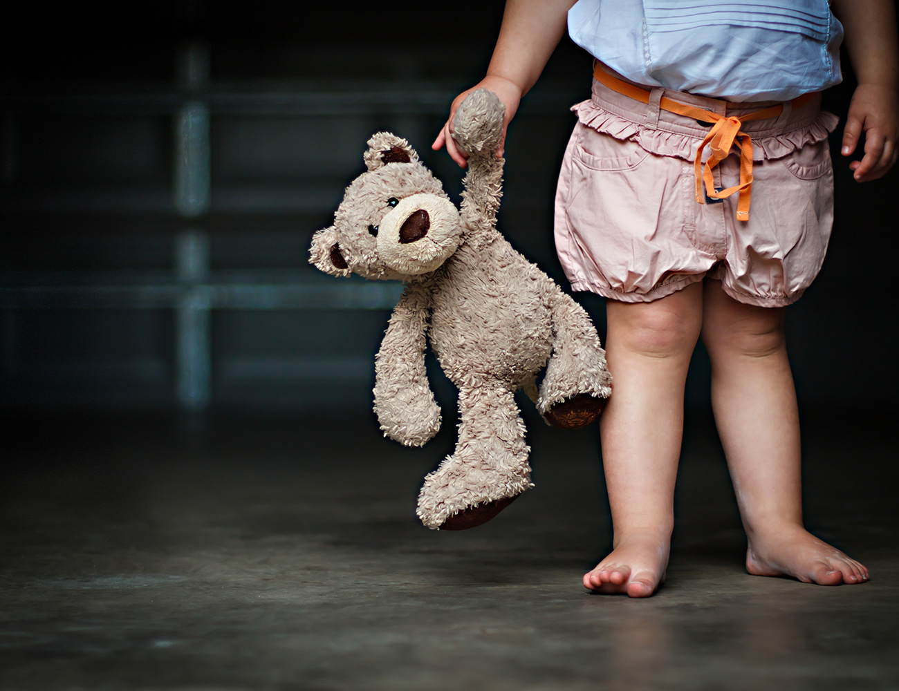 child with teddy